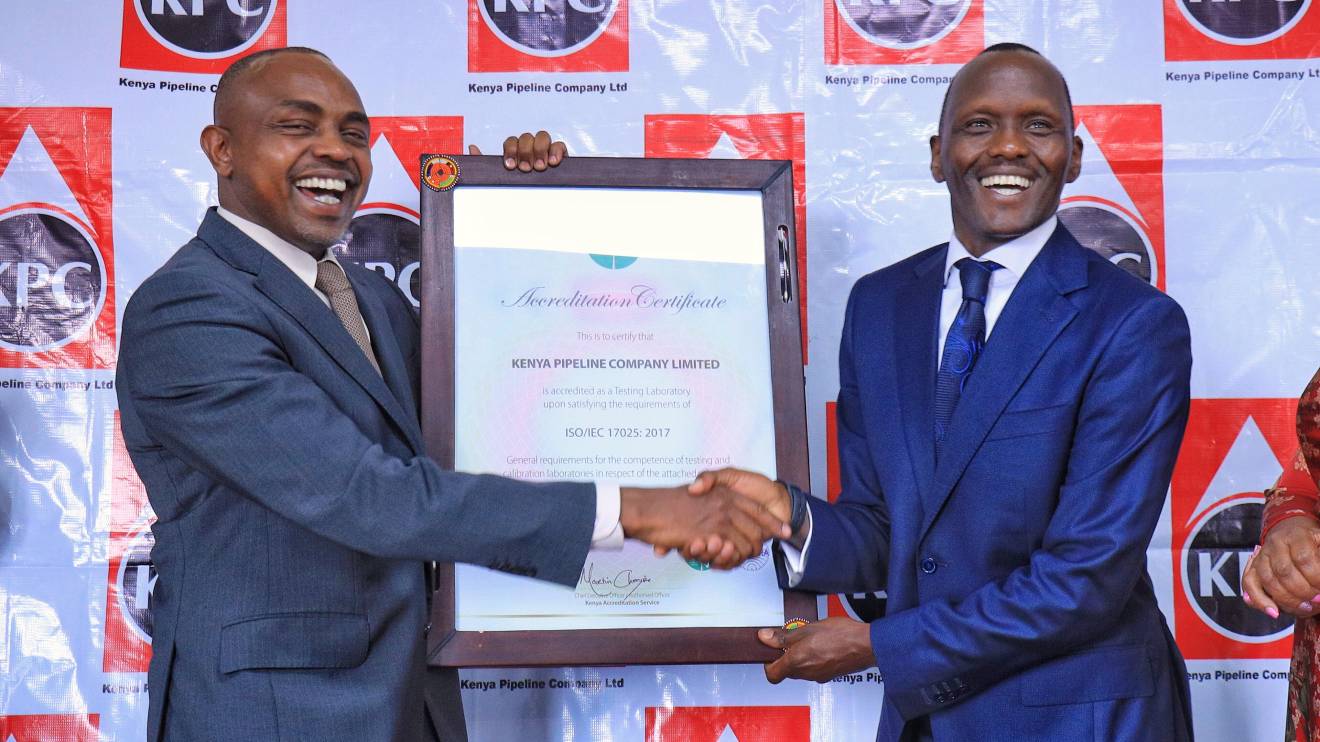 Kenya Pipeline Managing Director Joe Sang (Right) receives the ISO 17025:2017 certification from Kenya Accreditation Service (KENAS) CEO Martin Chesire (left). PHOTO/COURTESY